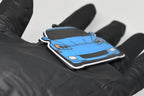 Side angle view showing 3D layered detail of light blue Chevrolet Corvette C6 keychain by LayerPlay Pocket Motors