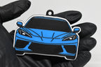 3D printed light blue Chevrolet Corvette C8 keychain held in hand, front view detail by LayerPlay Pocket Motors