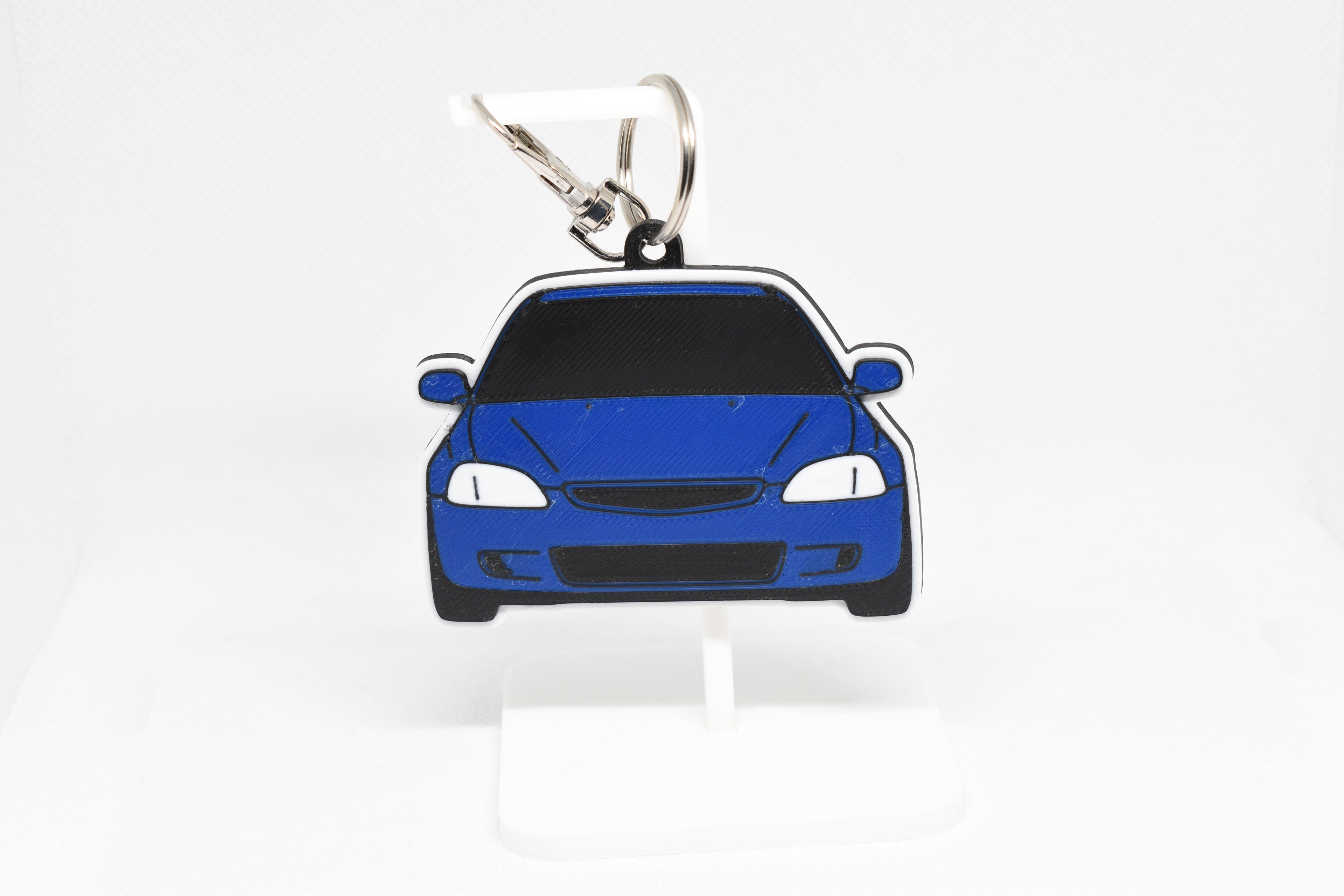 Pocket Motors Civic EK keychain displayed on a white stand with metal ring and clip.
