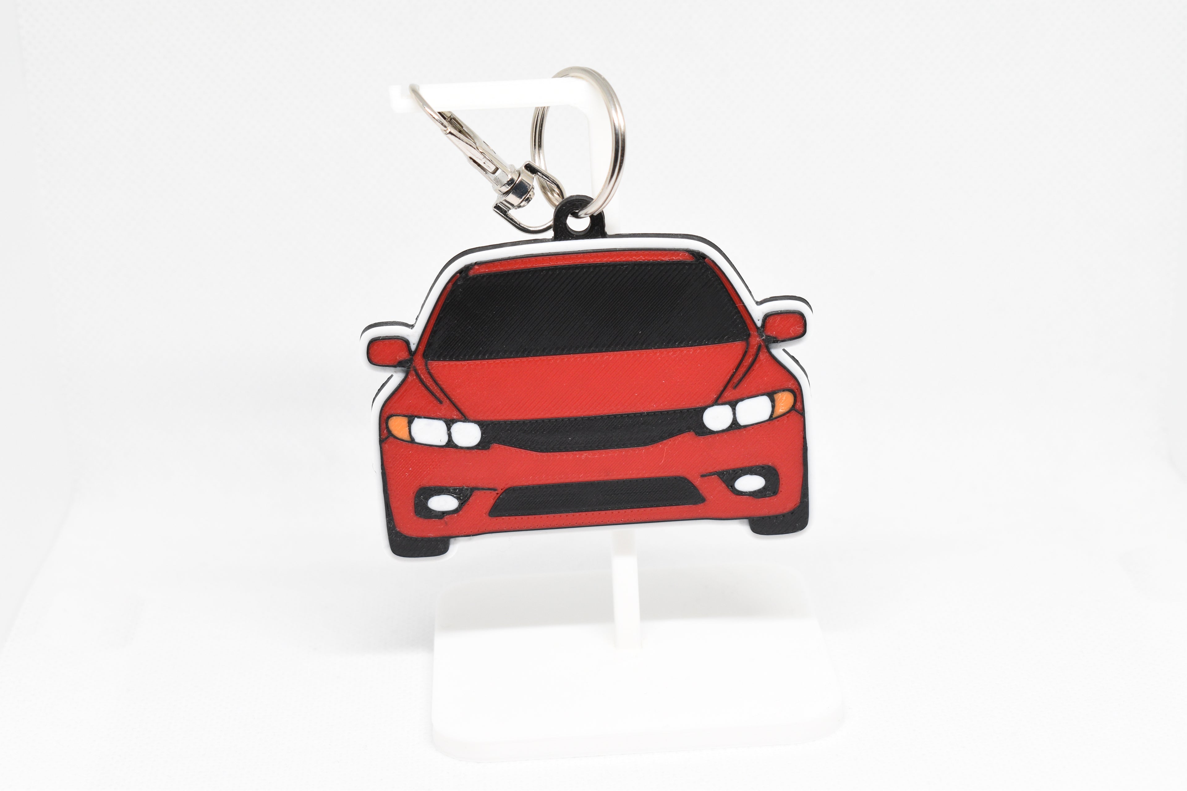 Pocket Motors Civic FA5 keychain displayed on a white stand with metal ring and clip.