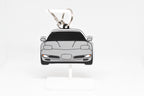 Pocket Motors Corvette C5 keychain displayed on a white stand with metal ring and clip.