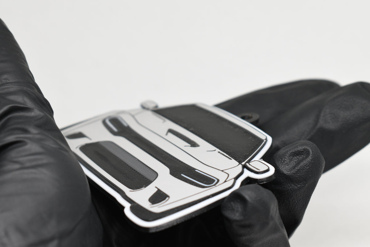 Side angle view showing 3D layered detail of light gray Dodge Charger Hellcat keychain by LayerPlay Pocket Motors