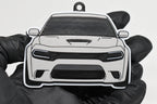 3D printed light gray Dodge Charger Hellcat keychain held in hand, front view detail by LayerPlay Pocket Motors