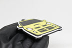 Side angle view showing 3D layered detail of yellow Dodge Neon SRT-4 keychain by LayerPlay Pocket Motors