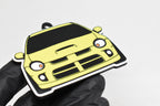 3D printed yellow Dodge Neon SRT-4 keychain held in hand, front view detail by LayerPlay Pocket Motors