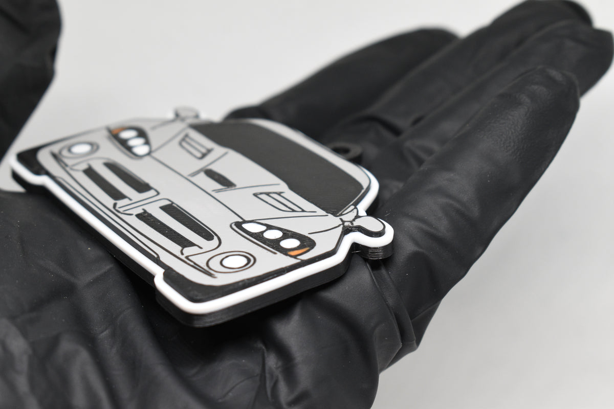 Side angle view showing 3D layered detail of light gray Dodge Viper 4th Gen keychain by LayerPlay Pocket Motors