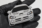 3D printed light gray Dodge Viper 4th Gen keychain held in hand, front view detail by LayerPlay Pocket Motors