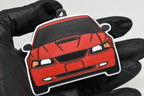 3D printed red Ford Mustang GT SN95 facelift keychain held in hand, front view detail by LayerPlay Pocket Motors