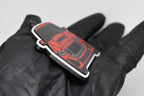 Side angle view showing 3D layered detail of red Ford Mustang S650 keychain by LayerPlay Pocket Motors