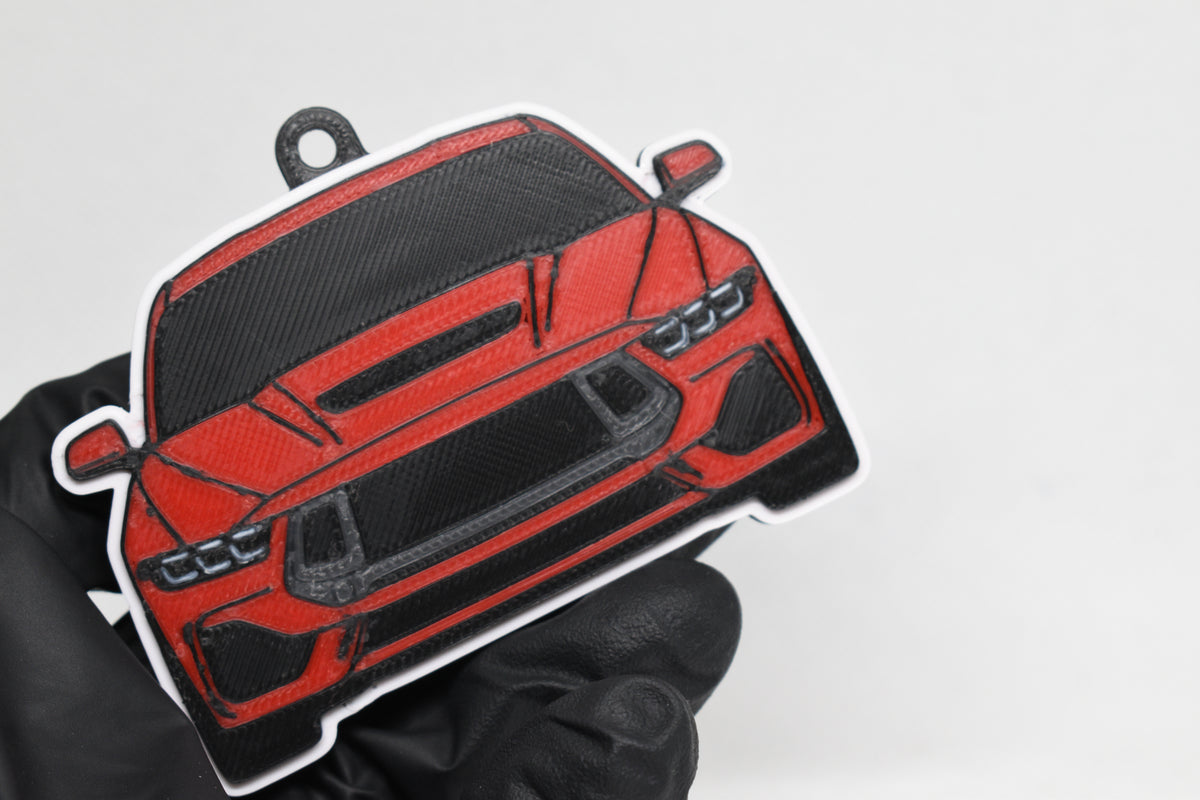 3D printed red Ford Mustang S650 keychain held in hand, front view detail by LayerPlay Pocket Motors