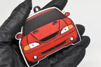 3D printed red Ford Mustang SN95 Cobra keychain held in hand, front view detail by LayerPlay Pocket Motors