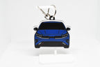 Pocket Motors Forte GT keychain displayed on a white stand with metal ring and clip.
