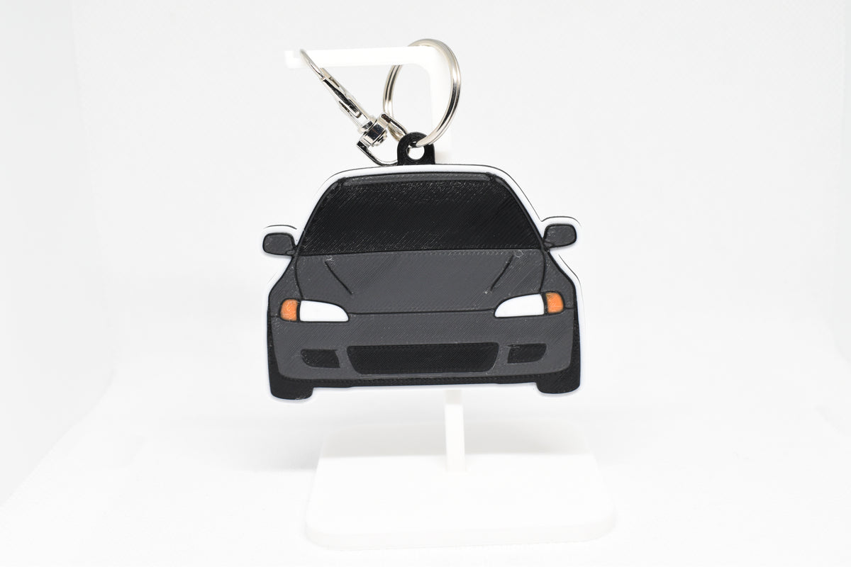 Pocket Motors Honda Civic Eg keychain displayed on a white stand with metal ring and clip.