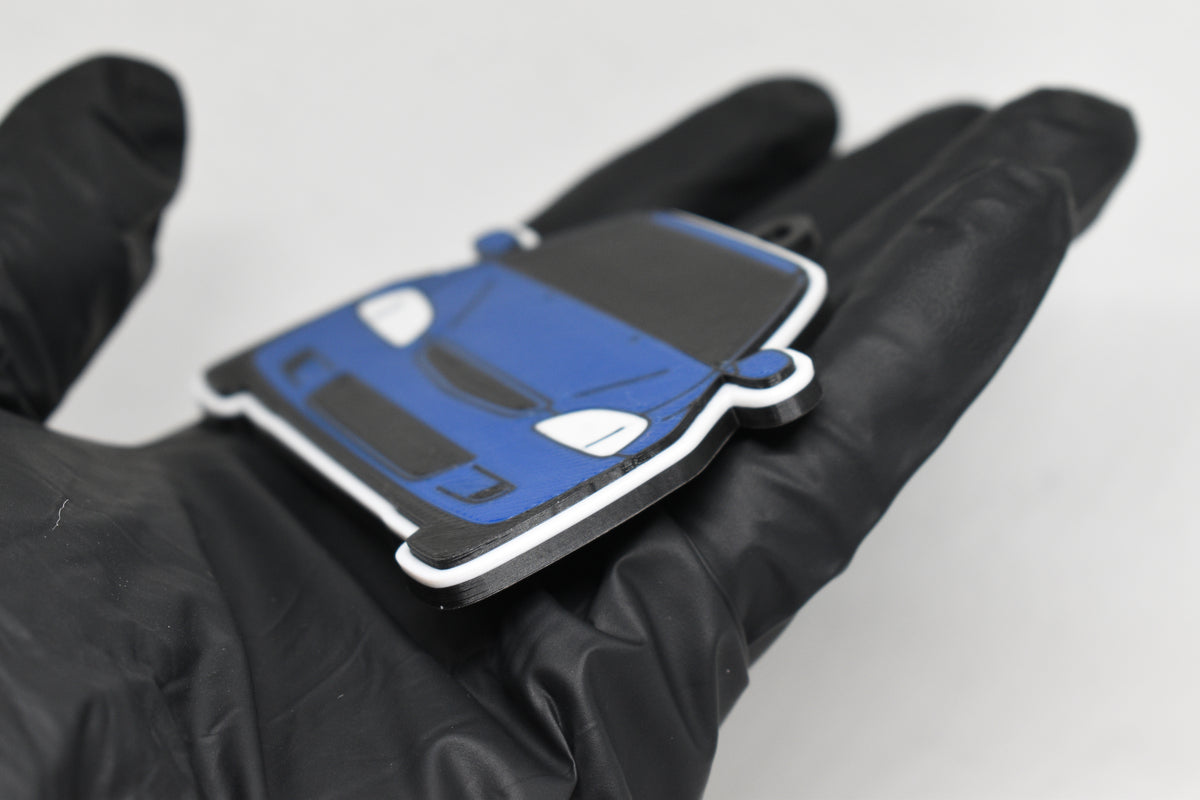 Side angle view showing 3D layered detail of blue Honda Civic EK keychain by LayerPlay Pocket Motors