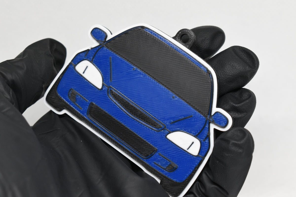 3D printed blue Honda Civic EK keychain held in hand, front view detail by LayerPlay Pocket Motors