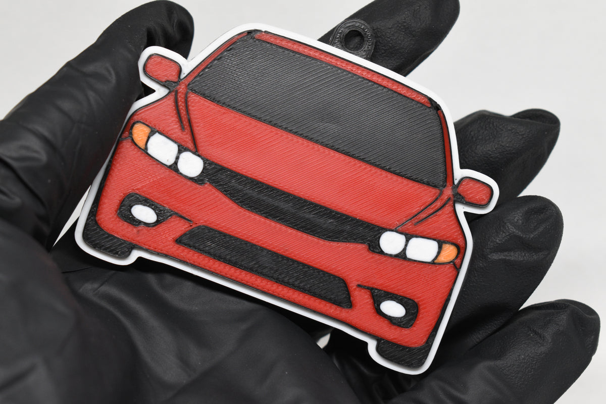 3D printed red Honda Civic FA5 keychain held in hand, front view detail by LayerPlay Pocket Motors