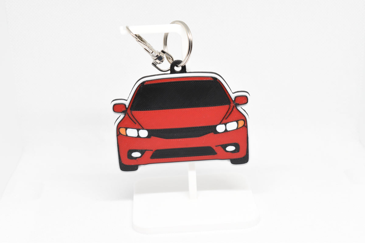 Pocket Motors Honda Civic FA5 keychain displayed on a white stand with metal ring and clip.
