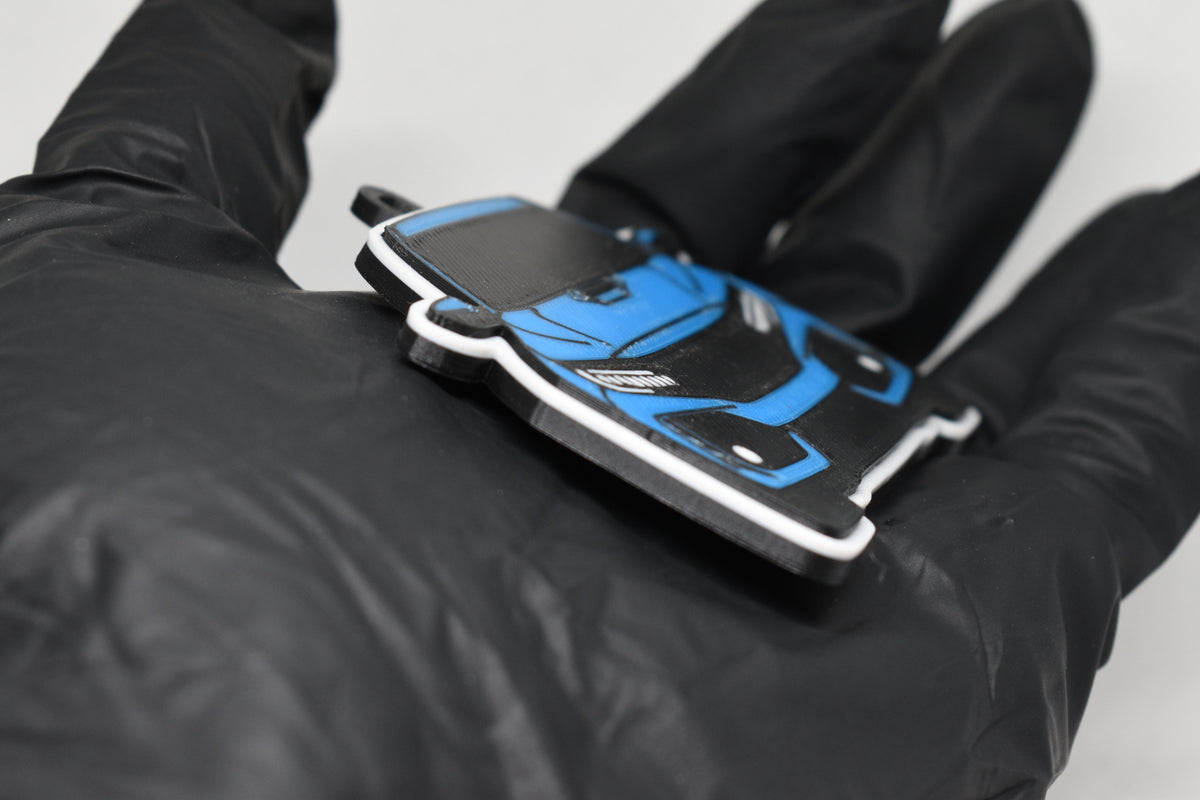 Side angle view showing 3D layered detail of light blue Honda Civic FK8 keychain by LayerPlay Pocket Motors
