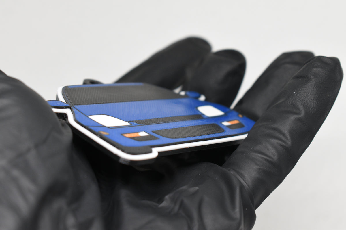 Side angle view showing 3D layered detail of blue Honda Prelude BB6 5th Gen keychain by LayerPlay Pocket Motors
