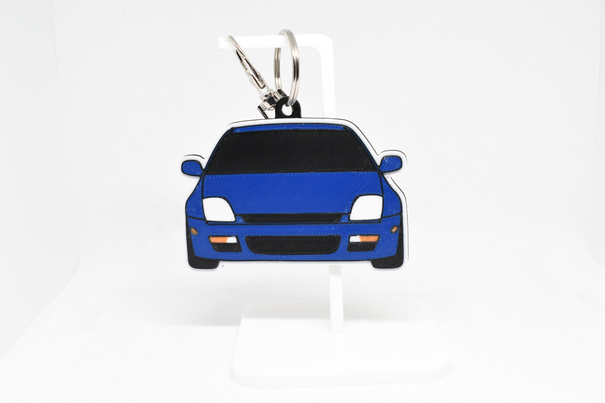 Pocket Motors Honda Prelude BB6 5th Gen keychain displayed on a white stand with metal ring and clip.