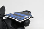 Side angle view showing 3D layered detail of blue Infiniti G35 Coupe keychain by LayerPlay Pocket Motors
