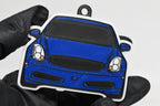 3D printed blue Infiniti G35 Coupe keychain held in hand, front view detail by LayerPlay Pocket Motors