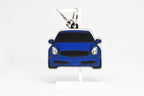Pocket Motors G35 Coupe keychain displayed on a white stand with metal ring and clip.