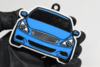 3D printed light blue Infiniti G37 Coupe keychain held in hand, front view detail by LayerPlay Pocket Motors