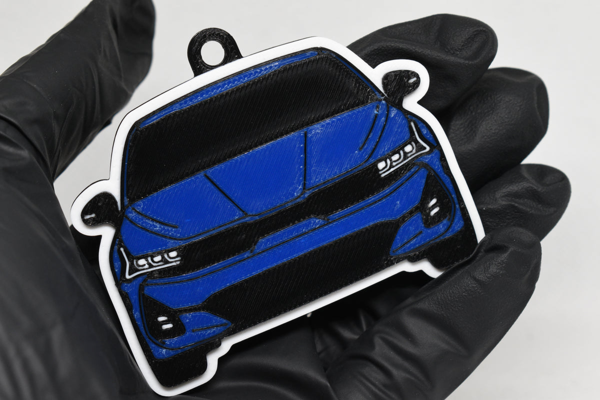 3D printed blue Kia K5 keychain held in hand, front view detail by LayerPlay Pocket Motors