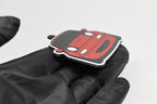 Side angle view showing 3D layered detail of red Mazda Miata NA keychain by LayerPlay Pocket Motors