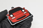 3D printed red Mazda Miata NA keychain held in hand, front view detail by LayerPlay Pocket Motors
