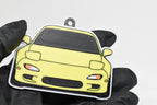 3D printed yellow Mazda RX-7 FD keychain held in hand, front view detail by LayerPlay Pocket Motors