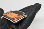 Side angle view showing 3D layered detail of orange McLaren 720S keychain by LayerPlay Pocket Motors