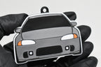 3D printed light gray Mitsubishi Eclipse 2nd Gen keychain held in hand, front view detail by LayerPlay Pocket Motors