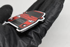 Side angle view showing 3D layered detail of red Mitsubishi Lancer Evolution 10 keychain by LayerPlay Pocket Motors