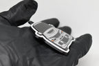 Side angle view showing 3D layered detail of light gray Mitsubishi Lancer Evolution 9 keychain by LayerPlay Pocket Motors