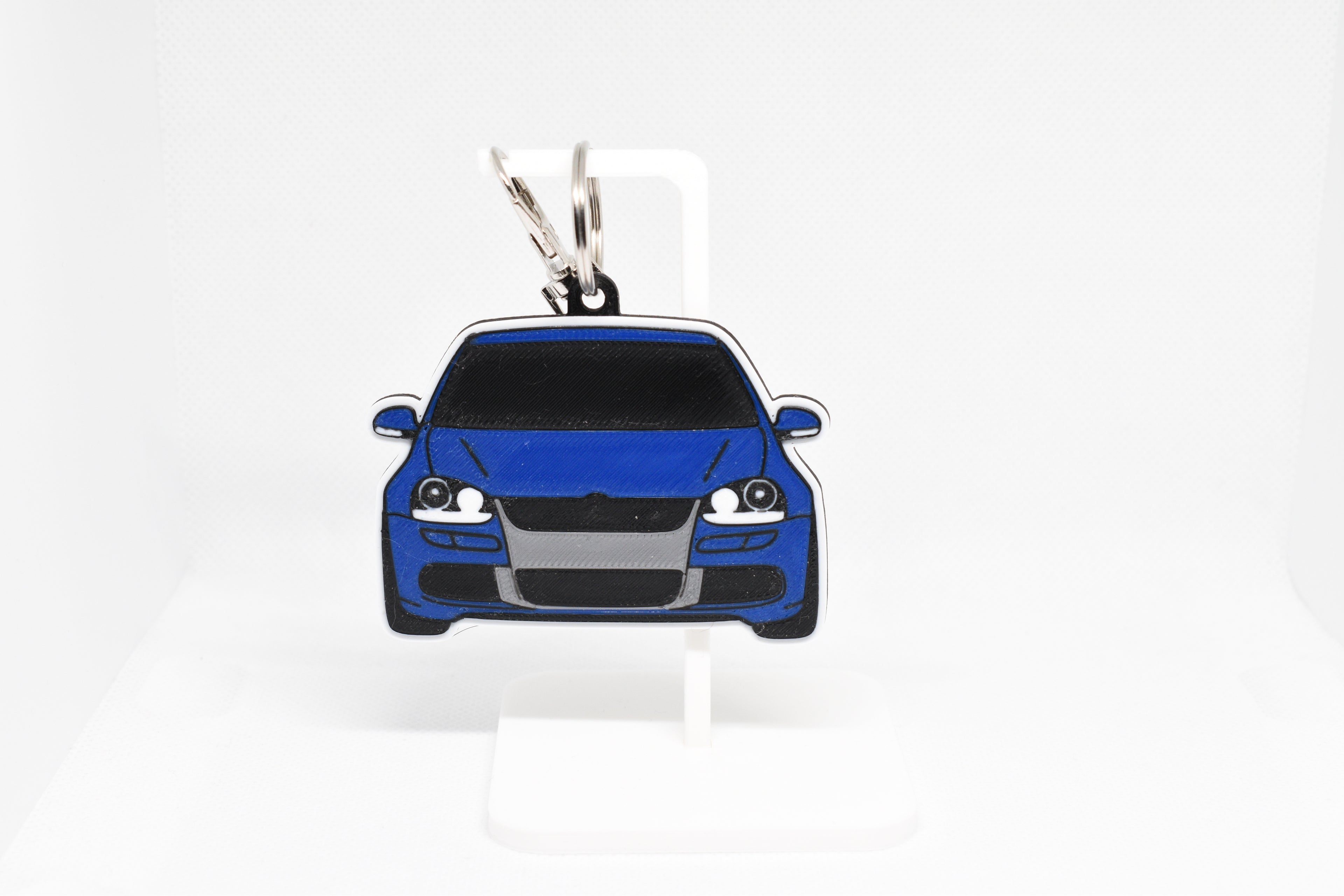 Pocket Motors MK5 Golf R32 keychain displayed on a white stand with metal ring and clip.