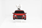 Pocket Motors MK5 GTI keychain displayed on a white stand with metal ring and clip.