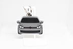 Pocket Motors MK6 GTI keychain displayed on a white stand with metal ring and clip.