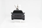 Pocket Motors MK7 GTI keychain displayed on a white stand with metal ring and clip.