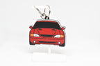 Pocket Motors Mustang Cobra SN95 keychain displayed on a white stand with metal ring and clip.