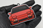 3D printed red Nissan 240SX S13 keychain held in hand, front view detail by LayerPlay Pocket Motors