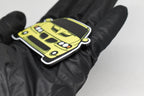 Side angle view showing 3D layered detail of yellow Pontiac GTO 5th Gen keychain by LayerPlay Pocket Motors