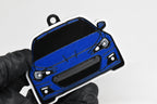 3D printed blue Subaru BRZ 1st Gen keychain held in hand, front view detail by LayerPlay Pocket Motors