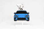 Layerplay Pocket Motors 2nd‑gen Subaru BRZ 3D printed keychain displayed on a white stand.
