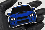 3D printed blue Blobeye Subaru WRX STI keychain held in hand, front view detail by LayerPlay Pocket Motors