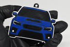 3D printed blue Subaru WRX STI VA facelift keychain held in hand, front view detail by LayerPlay Pocket Motors