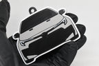 3D printed light gray Toyota GR Corolla facelift keychain held in hand, front view detail by LayerPlay Pocket Motors