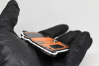 Side angle view showing 3D layered detail of orange Toyota GT86 keychain by LayerPlay Pocket Motors