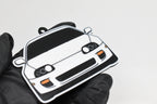 3D printed white Toyota Supra Mk4 keychain held in hand, front view detail by LayerPlay Pocket Motors